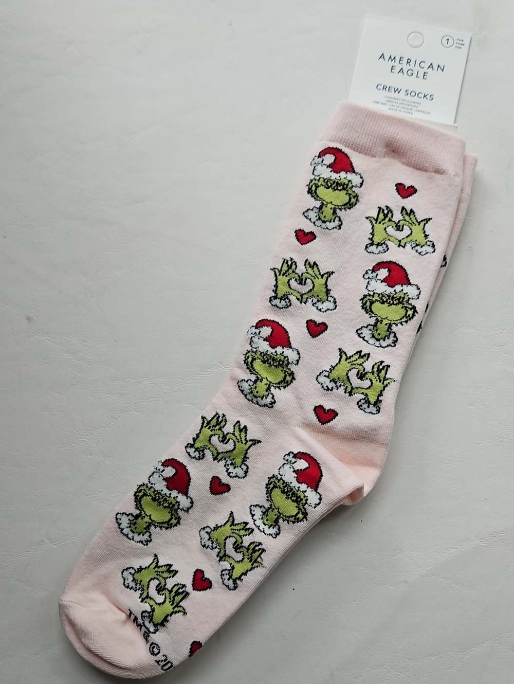 American Eagle Outfitters Light Pink Grinch Pattern Crew Socks